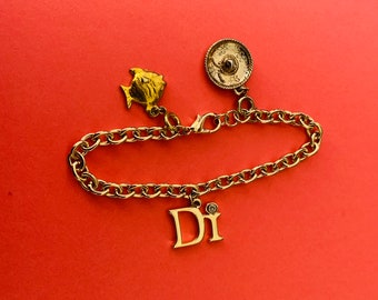 Decorative Gold Tone Chunky Link Bracelet With Di Name Charm and Fish and Mexican Hat Charms