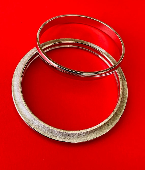Two Vintage Bright Silver Tone Bangles One Monet
