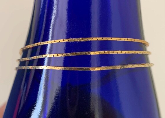 Three Thin Stack able Korea Signed Gold Tone Flat… - image 9