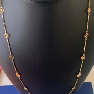 Avon Gold Toned 26 1/2 Inch Floral Bar and Link Chain Necklace
