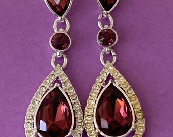 Lovely signed NRQ silver tone and purple rhinestone drop earrings