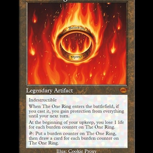 May include: A trading card featuring "The One Ring" with a fiery background. The ring is gold with text, surrounded by flames. The card is labeled "Legendary Artifact" and includes game instructions.