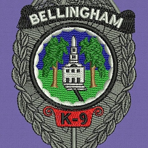May include: Embroidered patch featuring the word "BELLINGHAM" above a circular emblem. The emblem depicts a white building between two green trees, set against a blue and green background. The text "K-9" is displayed on a red banner.
