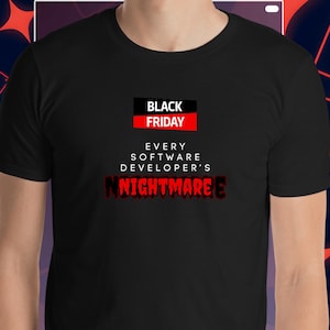 May include: Black t-shirt with the text "BLACK FRIDAY" in a black and red box, followed by "EVERY SOFTWARE DEVELOPER'S NIGHTMARE" in white and red lettering. The shirt is a crew neck.