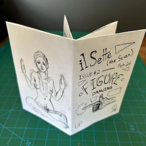 May include: A handmade zine titled "il Sette (the Seven)" with Issue #2 and the date Feb 26. The cover features a seated figure drawing and the word "FIGURE DRAWING". The zine is open, displaying the artwork.