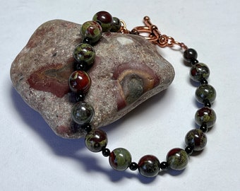 Dragon's blood jasper and onyx bracelet: charity donation