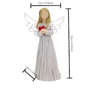 May include: A figurine of an angel, 4.72 inches tall, holding a red heart. The angel has blonde hair and white wings. The angel is wearing a white dress. The figurine is 2.76 inches wide and 1.57 inches deep.