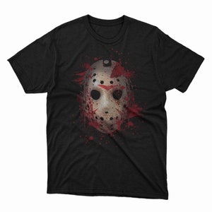 May include: Black t-shirt with a white hockey mask graphic splattered with red paint.