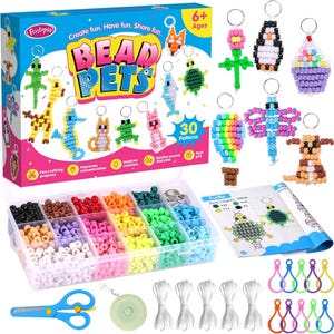 May include: A bead pets kit with a variety of colorful beads, keychains, and accessories. The kit includes a box with multiple compartments filled with beads in various colors, scissors, and a measuring tape. The box reads "BEAD PETS" and "Create fun. Have fun. Share fun."