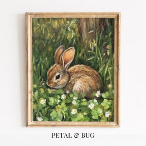 May include: A white ceramic mug with a black handle and the text "But First, Coffee" in a handwritten style. The mug is on a white surface. The mug is 10 cm tall.