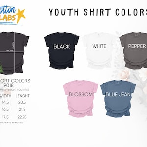 May include: A display of youth t-shirts in various colors: black, white, pepper, blossom, and blue jean. The image also includes a size chart with measurements in inches for small, medium, and large sizes of the unisex heavyweight youth tee.