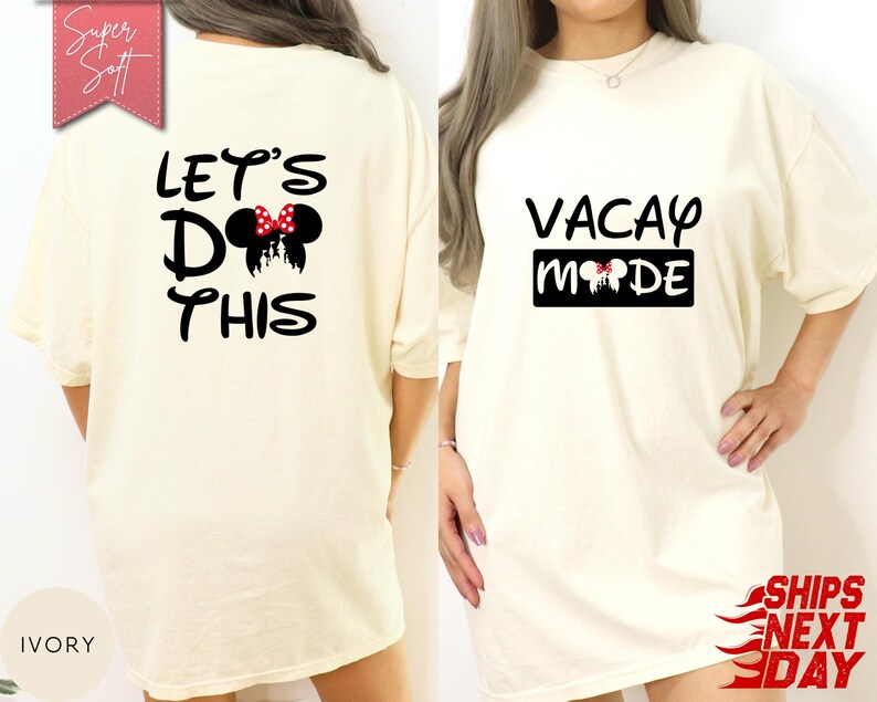 May include: Ivory-colored t-shirt with the text "LET'S DO THIS" and a Minnie Mouse design on the back. The front of the shirt has the text "VACAY MODE" with a Minnie Mouse design. The shirt is a loose fit.