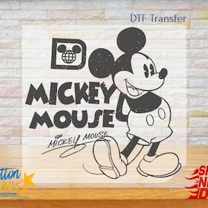 May include: Black and white graphic of Mickey Mouse with the text "Mickey Mouse" and a signature. The design includes a vintage-style logo with a globe and Mickey Mouse ears.