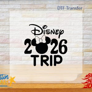 May include: Black and white graphic design featuring the word "Disney" above the number "2026" with a Minnie Mouse silhouette and the word "TRIP" below. The words "DTF Transfer" and "Cotton Labs" are also visible.