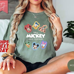 May include: A set of three ceramic mugs with a speckled, matte finish. The mugs are in shades of cream, light gray, and dark gray. Each mug has a simple, minimalist design and a rounded handle.