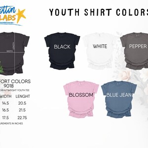May include: A display of youth t-shirts in various colors: black, white, pepper, blossom, and blue jean. The image includes size and measurement details in inches for the unisex heavyweight youth tee.