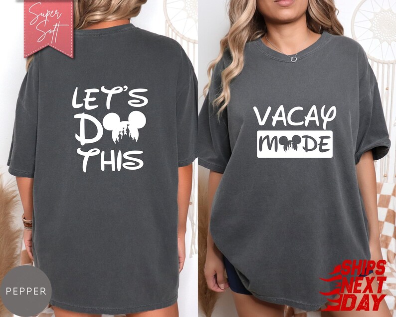 May include: Pepper-colored t-shirts with white text. One shirt reads "VACAY MODE" with a Mickey Mouse silhouette. The other shirt says "LET'S DO THIS" with a Mickey Mouse silhouette. The shirts are soft and comfortable.