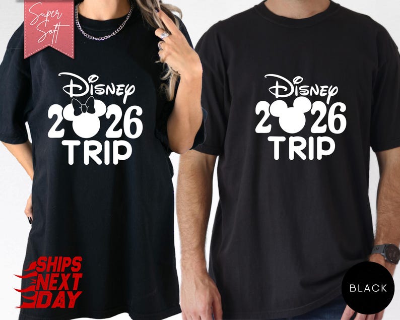 May include: Black t-shirts with a white Disney design. The design includes the Disney logo, the numbers "2026", and the word "TRIP". One shirt has a Minnie Mouse bow. The shirts are labeled "Super Soft" and "Ships Next Day".