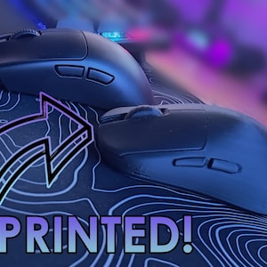 May include: Two black computer mice with side buttons are displayed on a blue patterned surface. A graphic with an arrow and the words "3D PRINTED!" are in the foreground. The image has a dark, futuristic aesthetic.
