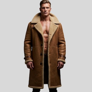 May include: A brown shearling coat with a wide collar and a button-down front. The coat features a light brown shearling lining and trim, with leather straps on the sleeves. The coat is knee-length and has a classic, timeless design.