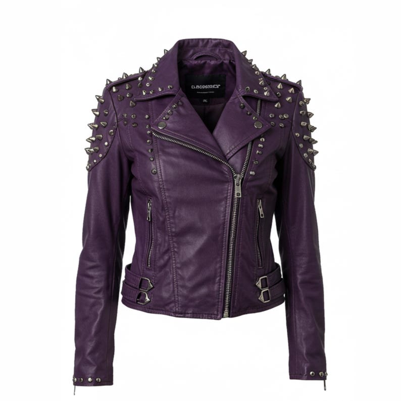 May include: A purple leather jacket with silver metal studs on the shoulders and collar. The jacket has a zipper closure, two zippered pockets, and buckle details at the waist. The brand name "D.COSMER" is visible on the collar.