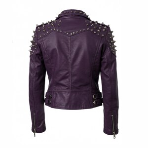 May include: A purple faux leather jacket with silver metal cone studs on the shoulders and collar. The back of the jacket features a vertical seam and two small buckles at the waist. The sleeves have zippers at the cuffs.