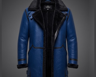 May include: A blue winter coat with a black faux fur collar and lining. The coat has a long length, with black trim and buckles. The coat is open, revealing the black interior. The coat is made of a leather-like material.