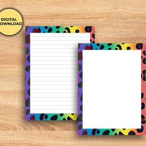 May include: Two sheets of white paper with a colorful leopard print border. One sheet is lined, and the other is blank. The border transitions from red to yellow to green to blue to purple. The text "DIGITAL DOWNLOAD" is in a yellow circle.