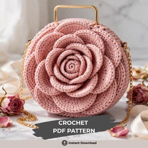 May include: A round, light pink crochet bag with a rose design on the front. The bag has a gold handle and a gold chain strap. The text "CROCHET PDF PATTERN" is displayed on the bottom of the image.