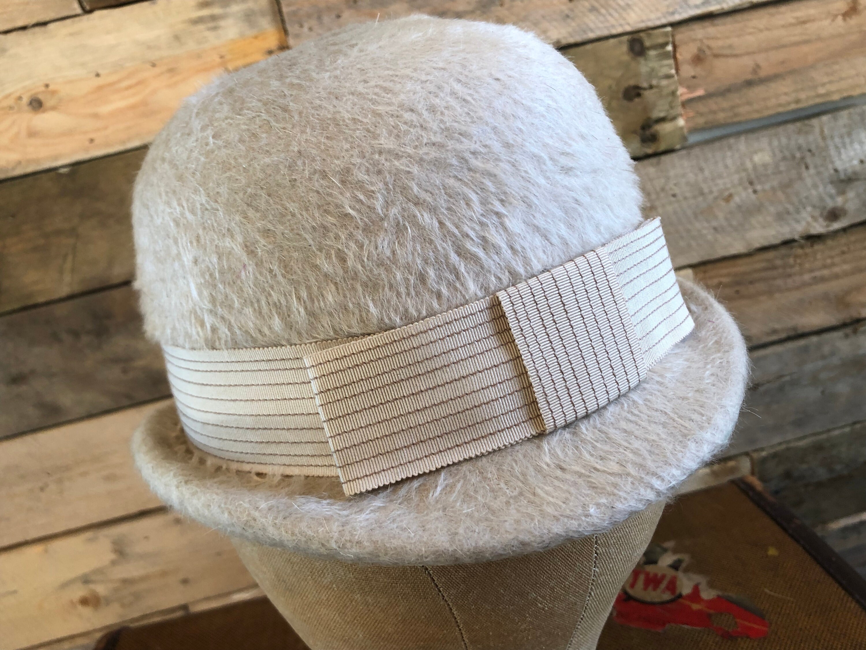 beige bowler hat