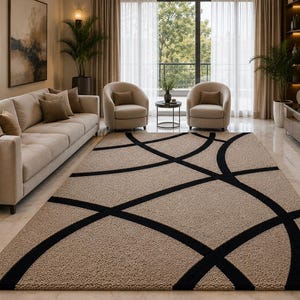 May include: A rectangular area rug featuring a textured beige pile with a bold, black geometric pattern consisting of intersecting curved lines that create large, sweeping arcs across the surface of the floor covering in a living room.
