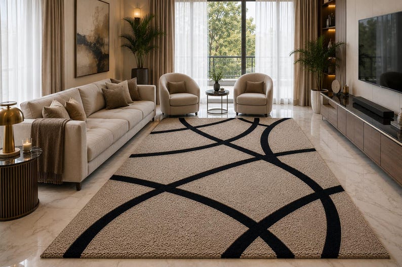 May include: A rectangular area rug featuring a textured beige pile with a bold, black geometric pattern consisting of intersecting curved lines that create large, sweeping arcs across the surface of the floor covering in a living room.