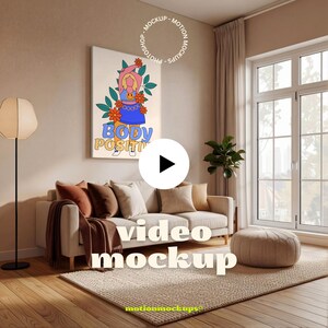 May include: A living room scene with a beige sofa, throw pillows, and a rug. A framed artwork with the words "BODY POSITIVITY" is on the wall. A floor lamp and a round ottoman are also visible. The words "video mockup" are displayed.