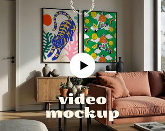 May include: A living room scene featuring two framed art prints with colorful illustrations. A sofa, wooden cabinet, and small table with plants are in front of the art. The words "video mockup" are displayed on the image.