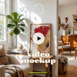 May include: A framed art print featuring a bouquet of red roses, with the text "let's fall in love". The print is displayed on a wooden table in a well-lit room. The words "video mockup" are displayed on the image.
