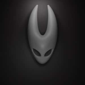 May include: A gray, stylized mask with a smooth surface and two eye-shaped openings. The mask has a rounded, elongated shape with two upward-curving horns. The background is a solid black, creating a contrast that highlights the mask's form.