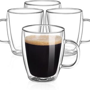 May include: Four clear glass mugs with handles. One mug is filled with dark coffee and foam. The mugs have a double-walled design, creating an insulated effect. The mugs are suitable for hot or cold beverages.