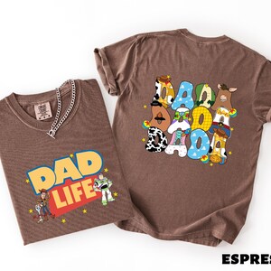 Two t-shirts with cartoon characters and text printed on them.
