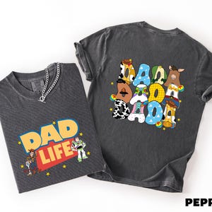 two t-shirts, one with the text "DAD LIFE" and the other with the text "PEPPER".