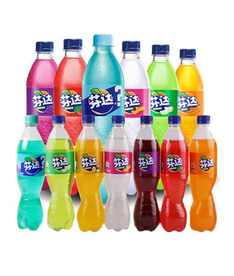May include: A collection of colorful, plastic soda bottles with blue, pink, green, and orange labels. The bottles are filled with various colored liquids and have blue caps. The labels feature a fruit and leaf design.