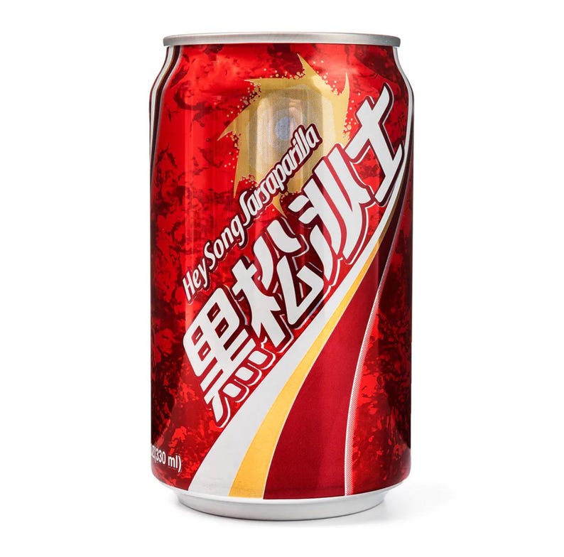 May include: A red and silver Hey Song Sarsaparilla soda can. The can features Chinese characters and English text. The can has a metallic sheen and a white base. The can contains 330 ml of liquid.