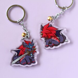 May include: Two clear acrylic keychains featuring a cartoon wolf with red hair and a sword. One keychain shows the wolf holding the sword, while the other shows the wolf sitting with its tail curled around its legs.