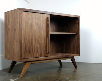 The "Uzi" is a mid century modern TV console, record player, bookshelf