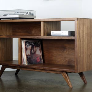 The "A Bomb" is a mid century modern  console -designed for records, turntable, and audio equipment.