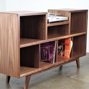 Mid-century modern stereo console for a record player and record storage. The " Cloud9"