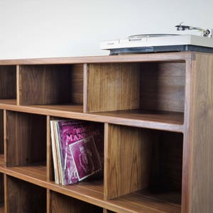 The StudioK is a mid-century modern stereo console for a record player and record storage image 1