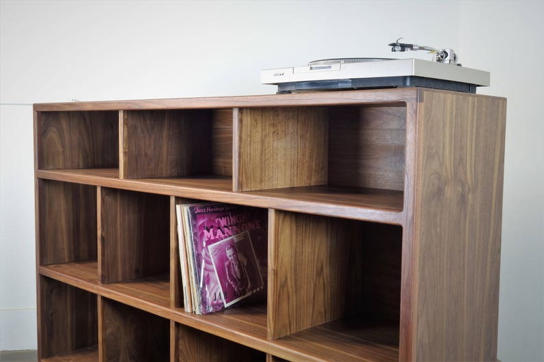 The StudioK is a mid-century modern stereo console for a record player and record storage image 1