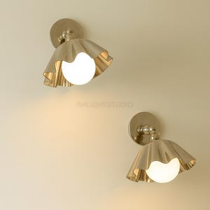 Vintage Brass Ruffle Wall Sconce Pair with Globe Glass, Mid Century Flower Shade Wall Light
Mid Century Modern Brass Wall Sconce Pair with Globe Glass, Italian Style Handmade Wall Lamp
Vintage Flower Wall Sconce Pair, Brass Ruffle Shade with Globe Glass, Bedroom Hallway Light
Italian Style Brass Wall Light Pair with Globe Glass, Mid Century Handmade Wall Sconce
Brass Ruffle Wall Sconce Pair with Globe, Vintage Mid Century Wall Light for Bedroom Hallway 
Wall Sconce Wall Light Wall Lamp Fixture