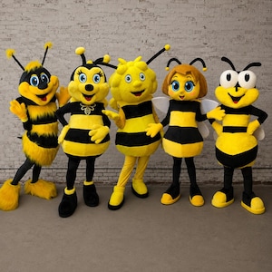 May include: Five bee mascot costumes standing in a row. Each character features a yellow and black striped body, large expressive eyes, and antennae. The costumes vary in texture, from fuzzy fur to smooth fabric, with some wearing white wings.