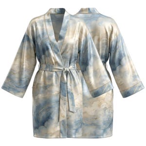 May include: A silky, knee-length robe with a cloud-like pattern in shades of blue, cream, and gold. The robe features wide sleeves, a tie belt, and a V-neck design. The second robe is visible in the background.
